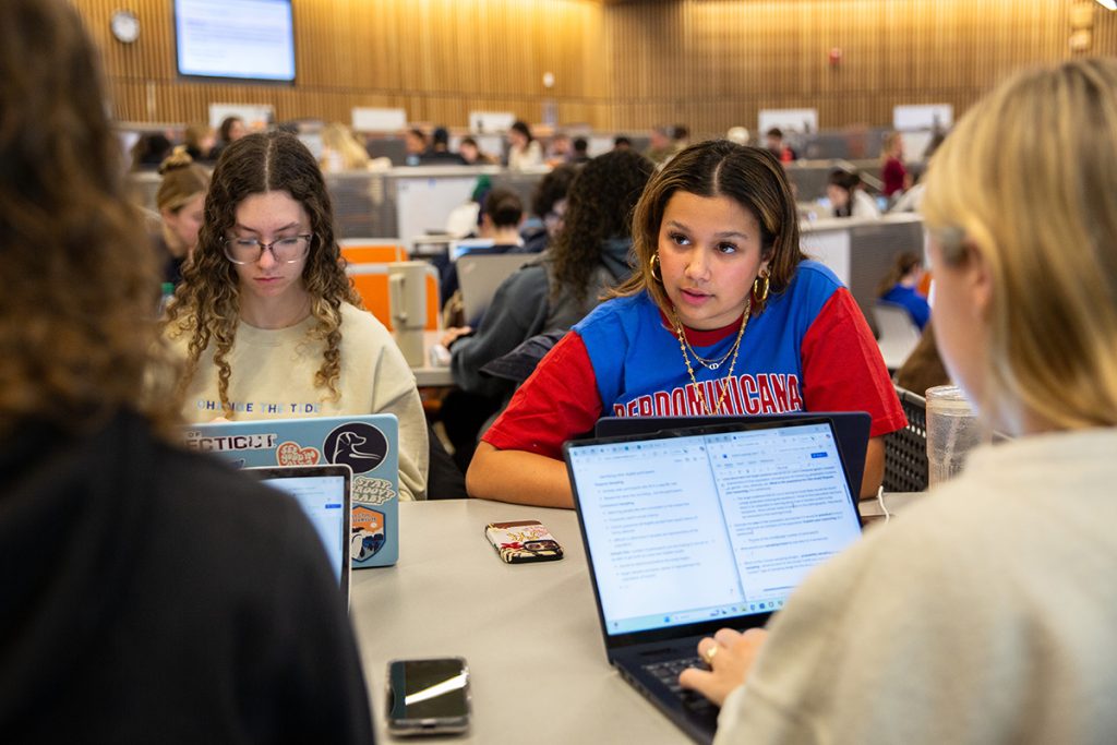 Students sit with their laptops during COMM 2000Q: Research Methods in Communication in the Science 1 Research Center.